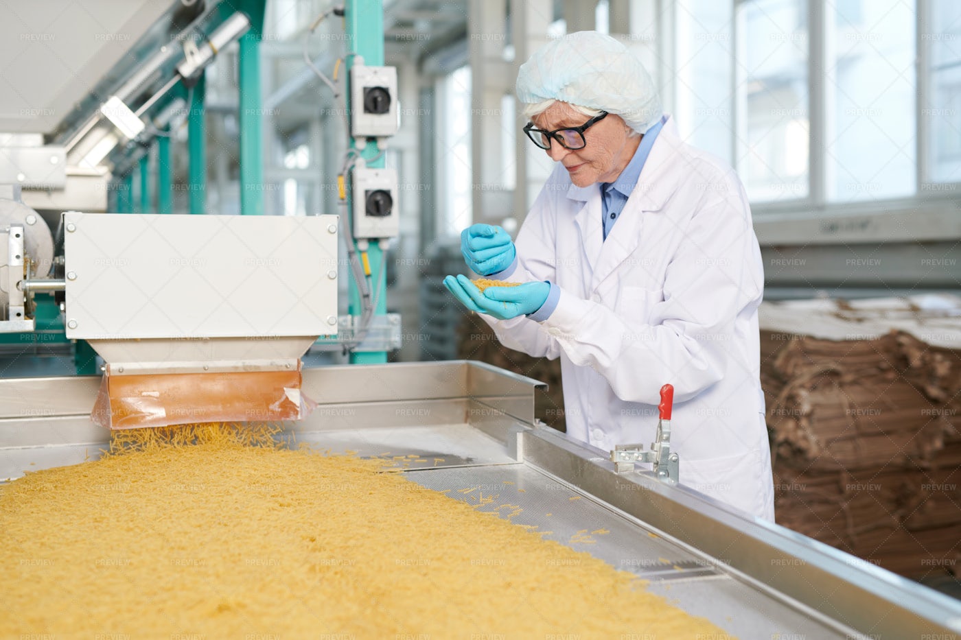 Senior Worker At Production Line: Stock Photos