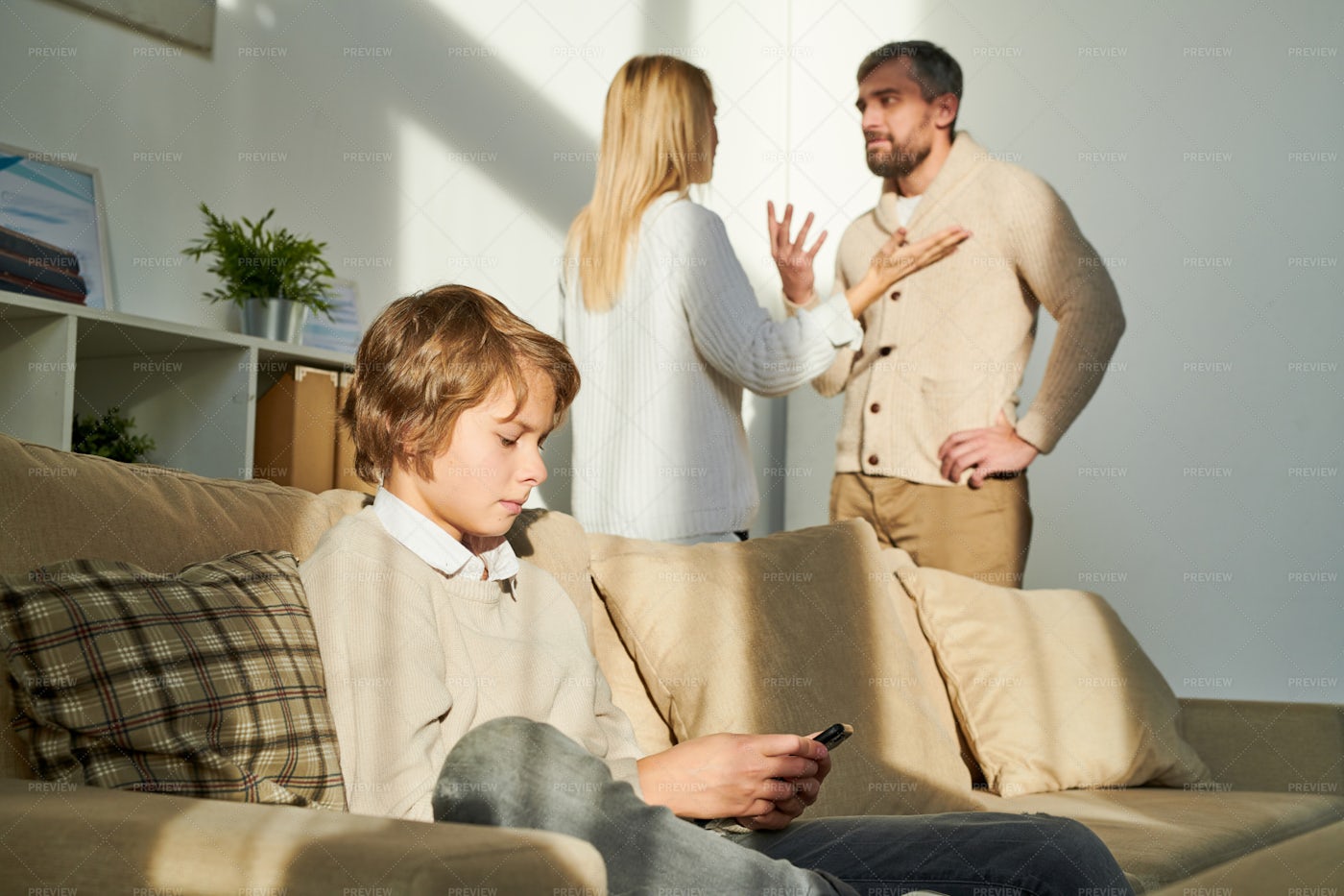 Boy Being Closed Off While Parents...: Stock Photos
