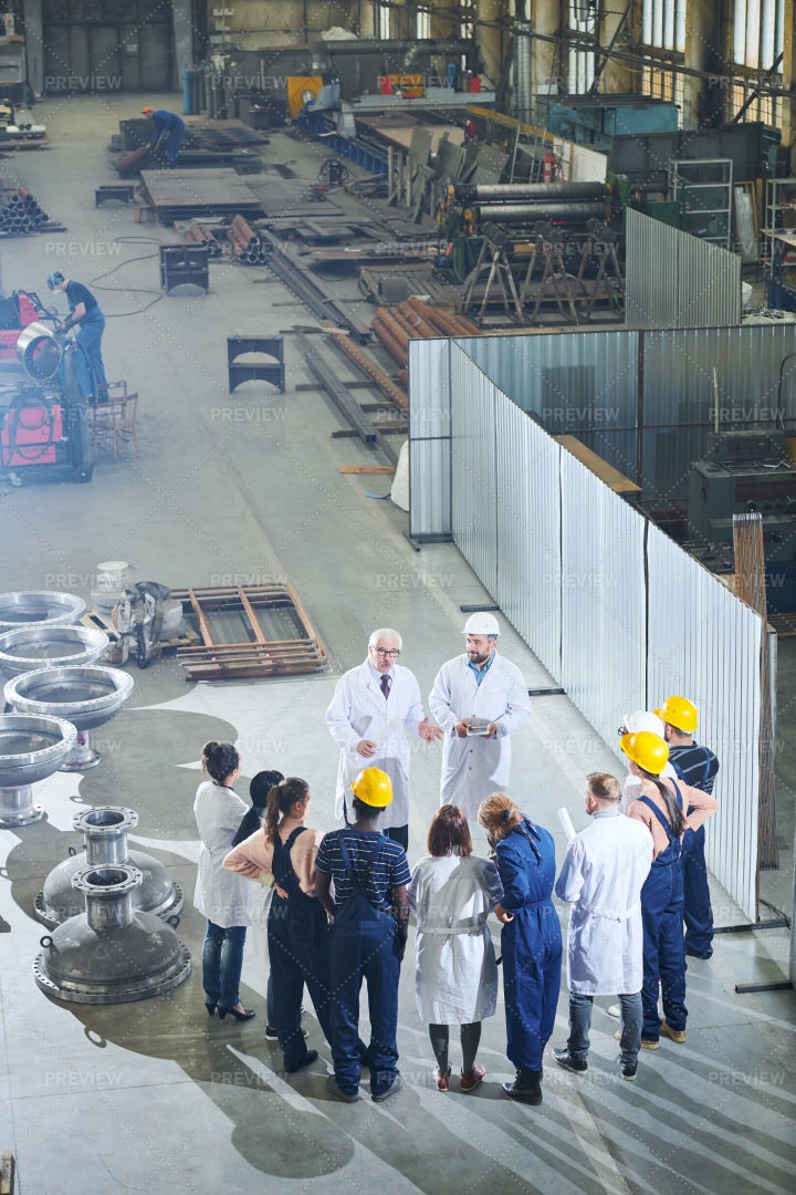 Factory Workers Meeting With...: Stock Photos