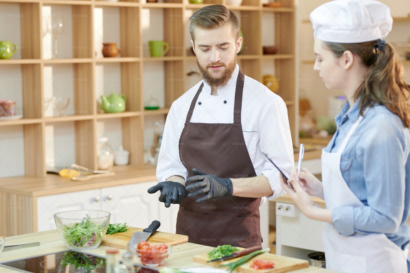 Two Young Chefs In Restaurant...: Stock Photos