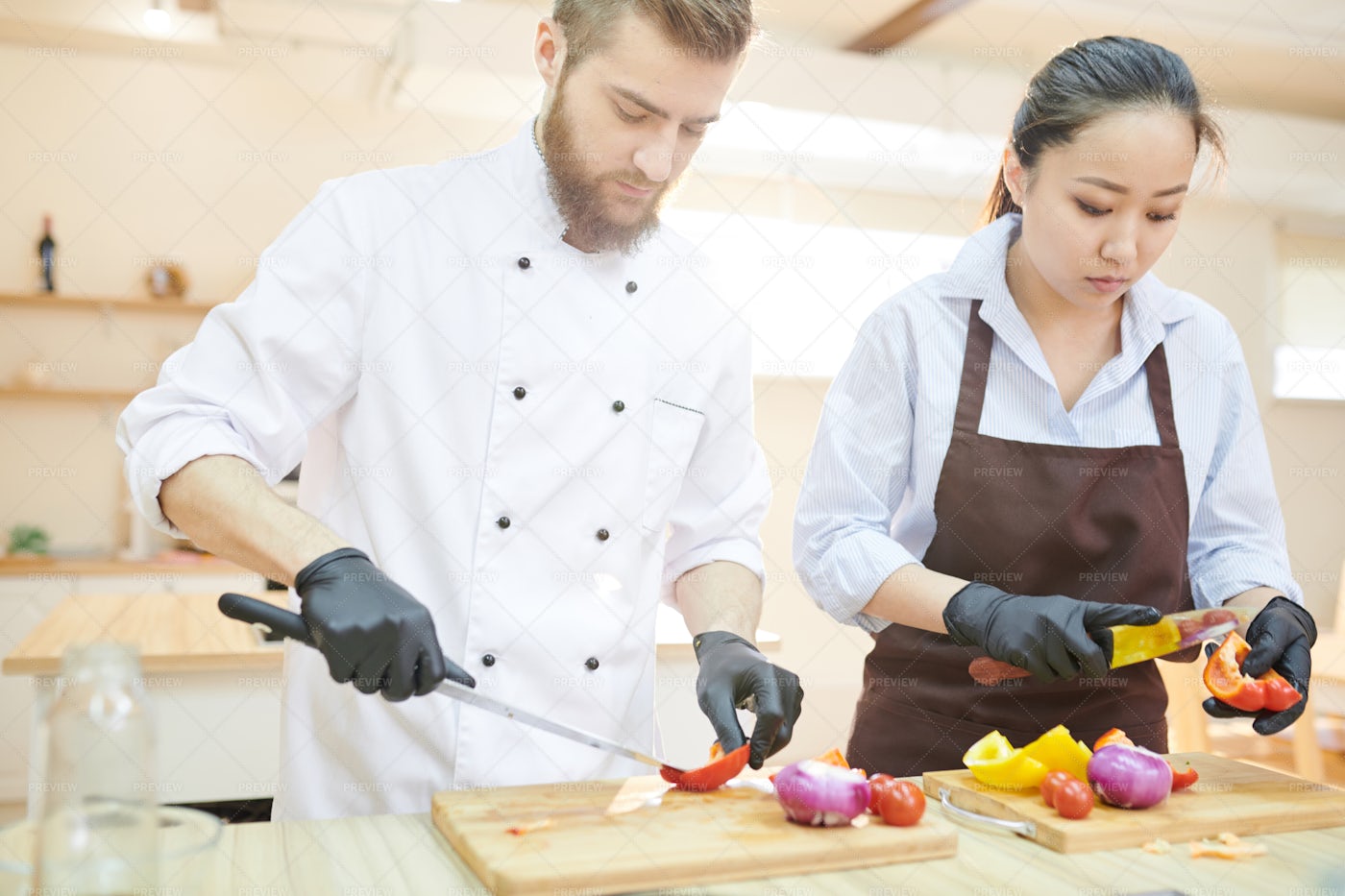 Two Modern Chefs Working In Kitchen: Stock Photos