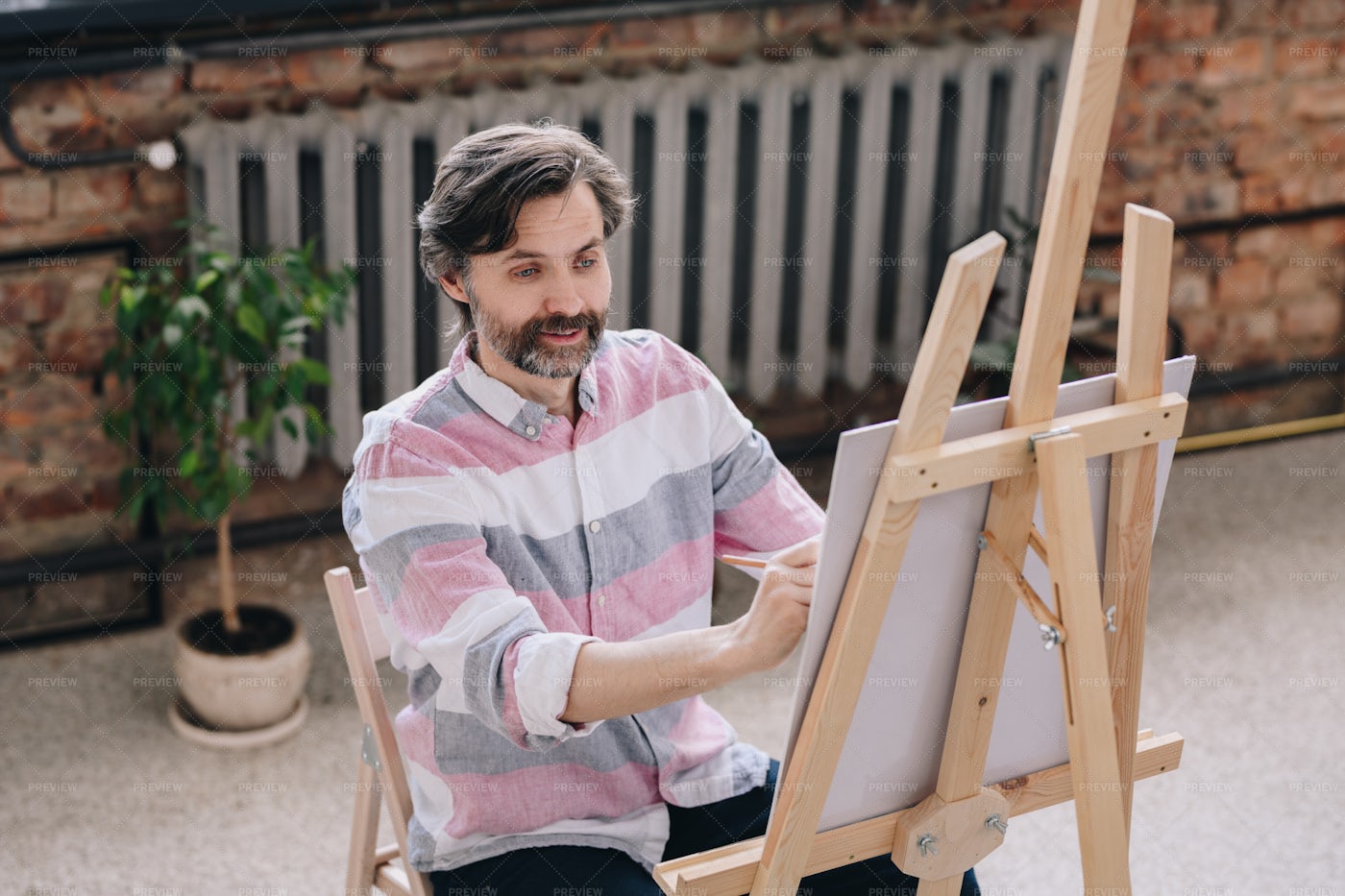 Mature Artist Painting In Art...: Stock Photos