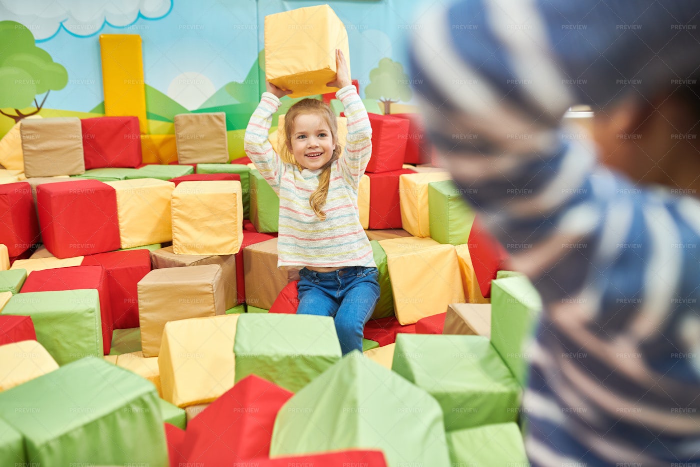 Two Kids Playing In Foam Pit: Stock Photos