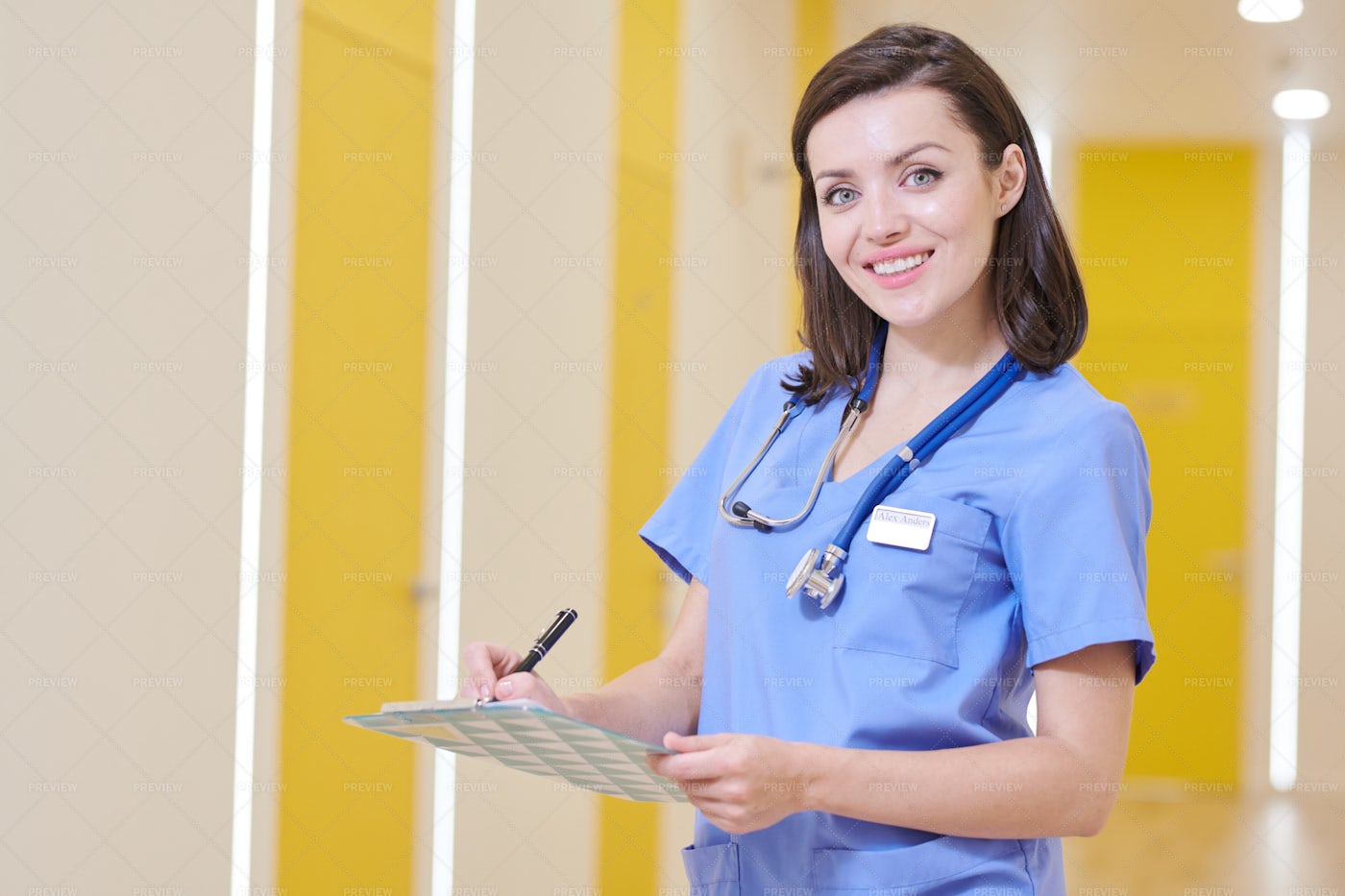 Smiling Nurse Posing In Clinic: Stock Photos