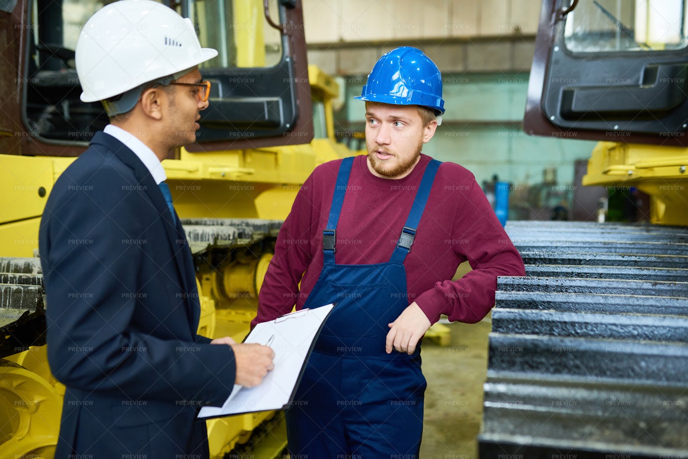 Showing Heavy Equipment To Customer: Stock Photos