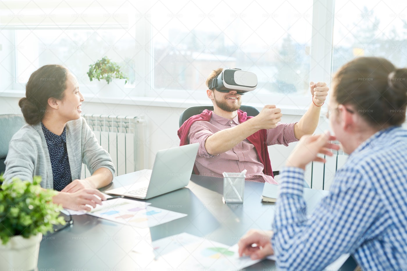 Office Workers Trying New Gadget: Stock Photos