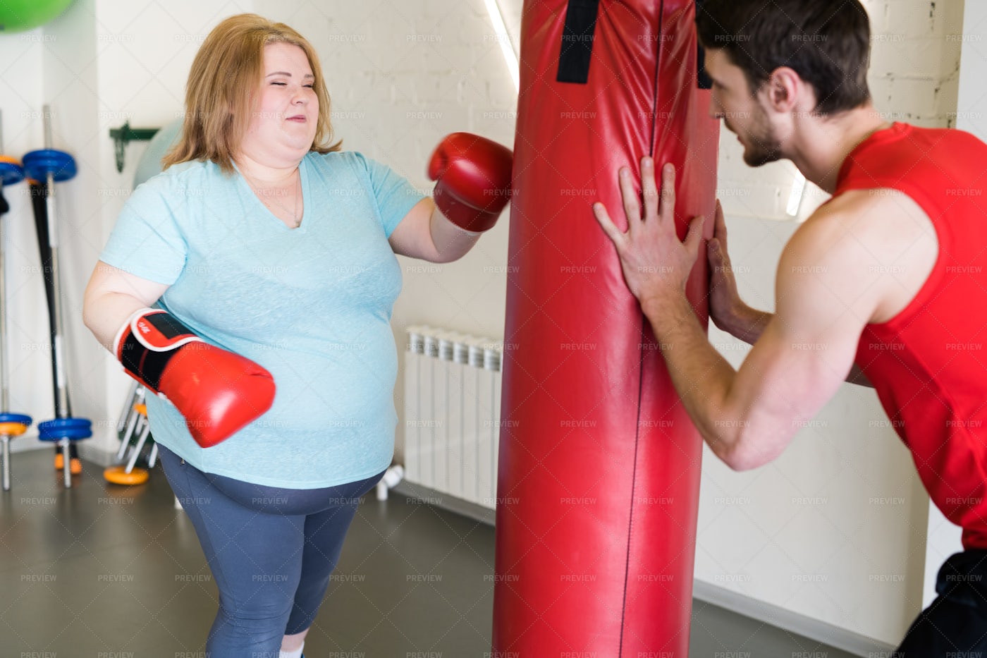 Obese Woman Boxing In Gym: Stock Photos