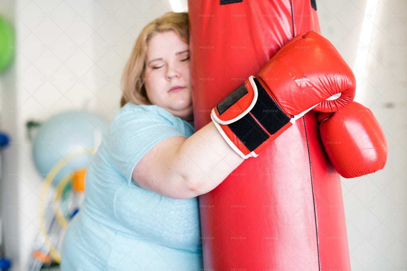 Tired Obese Woman Training In Gym: Stock Photos