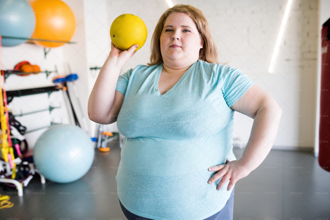 Overweight Woman Training With Ball: Stock Photos