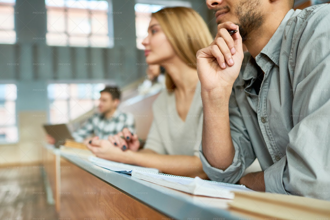 Students Listening To Lecture At...: Stock Photos