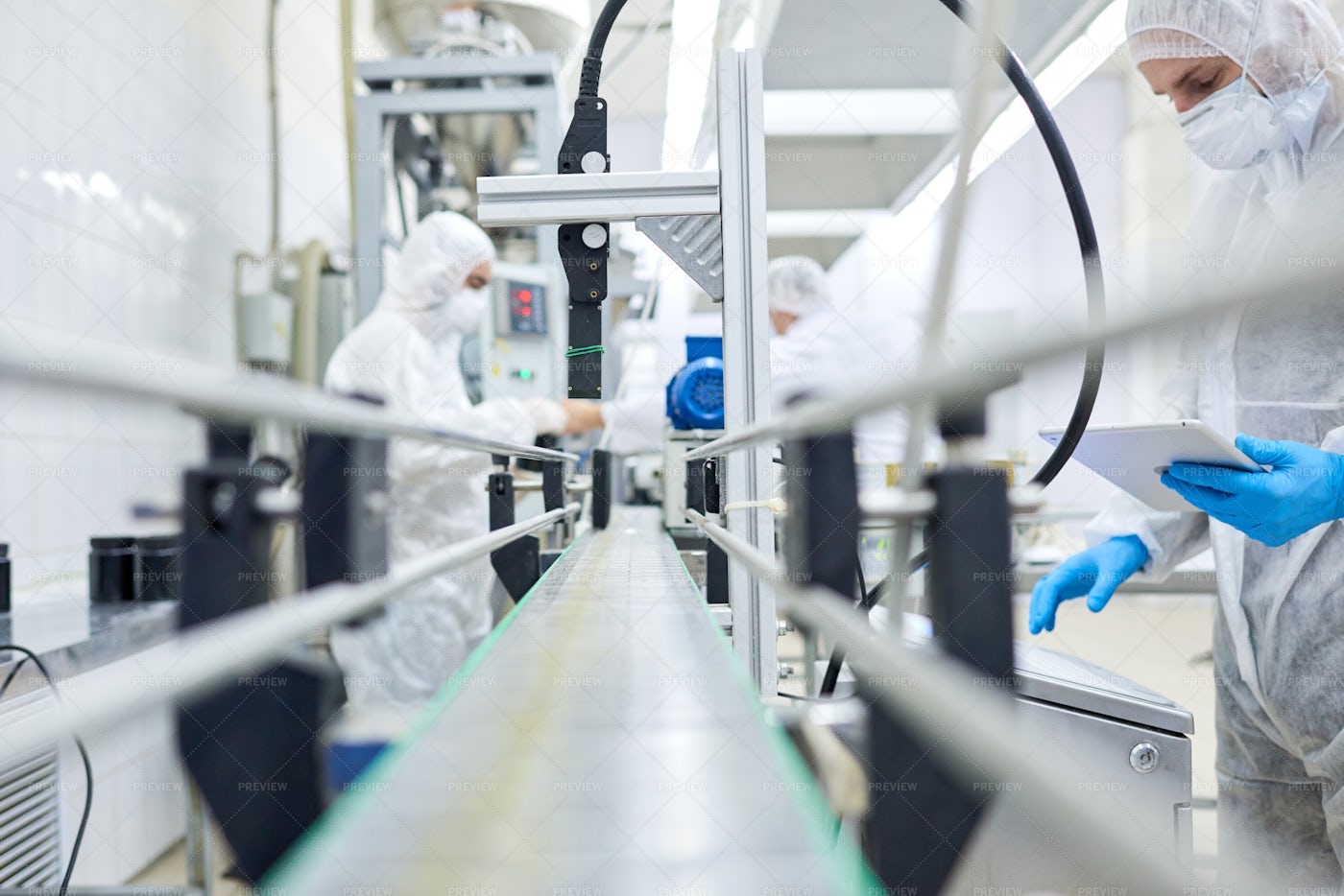Factory Workers Standing At...: Stock Photos