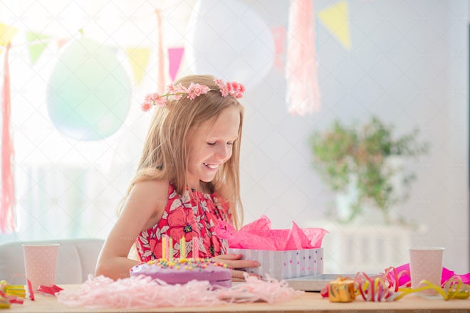 Girl Opens Birthday Gift - Stock Photos | Motion Array