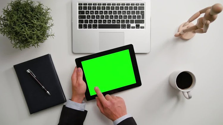 Man On A IPad With A Green Screen: Stock Video