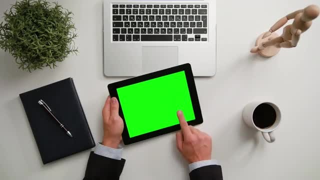 Man on a iPad with Green Screen: Stock Video