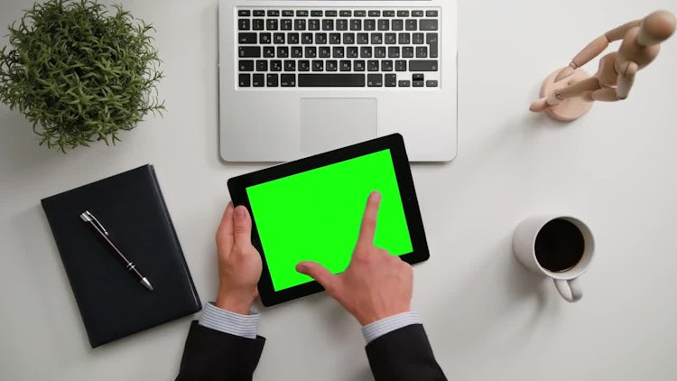 Man On A IPad With A Green Screen: Stock Video