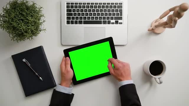 Man Holding An iPad With Green Screen: Stock Video