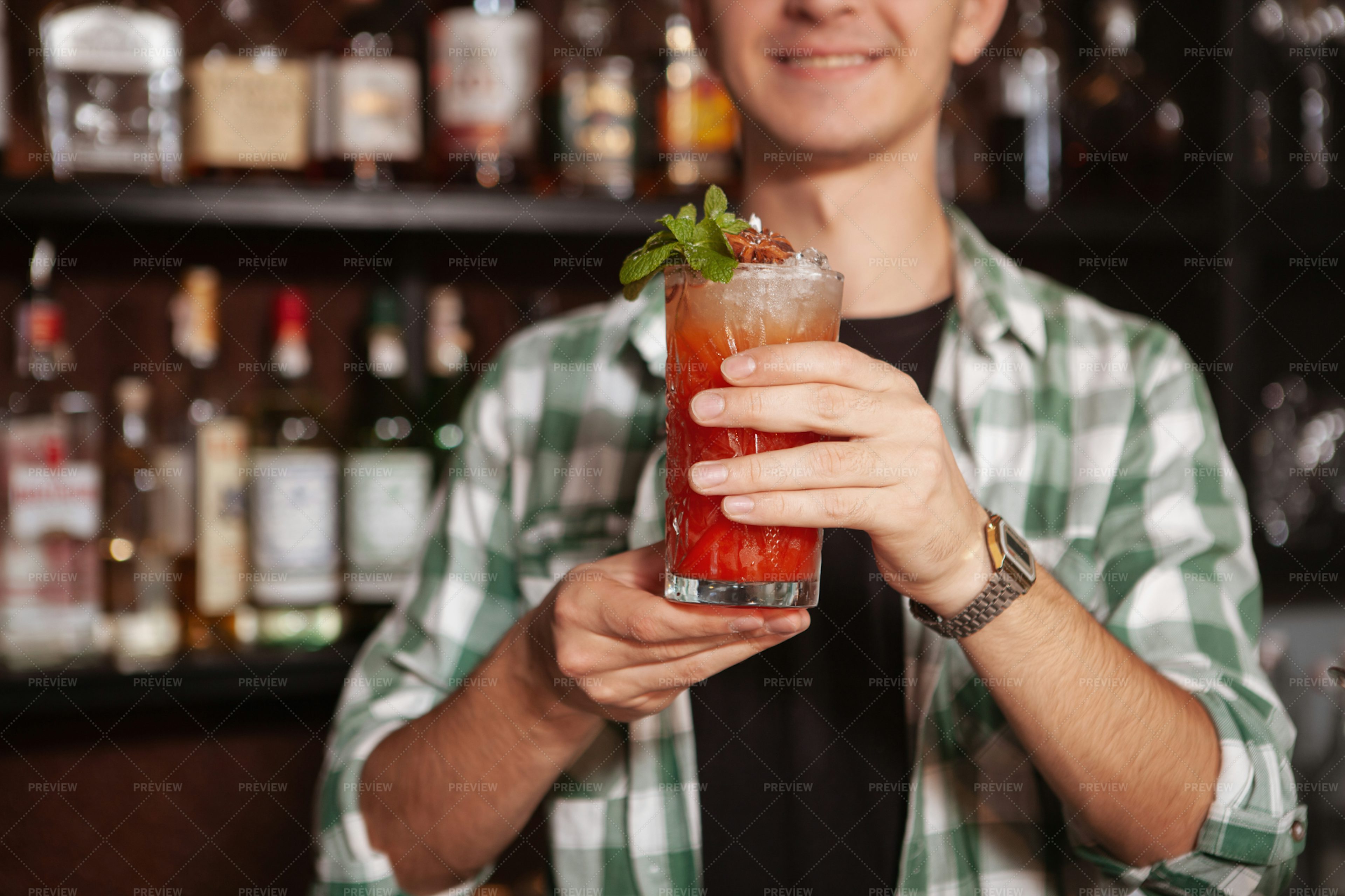 bartender-presents-cocktail-stock-photos-motion-array