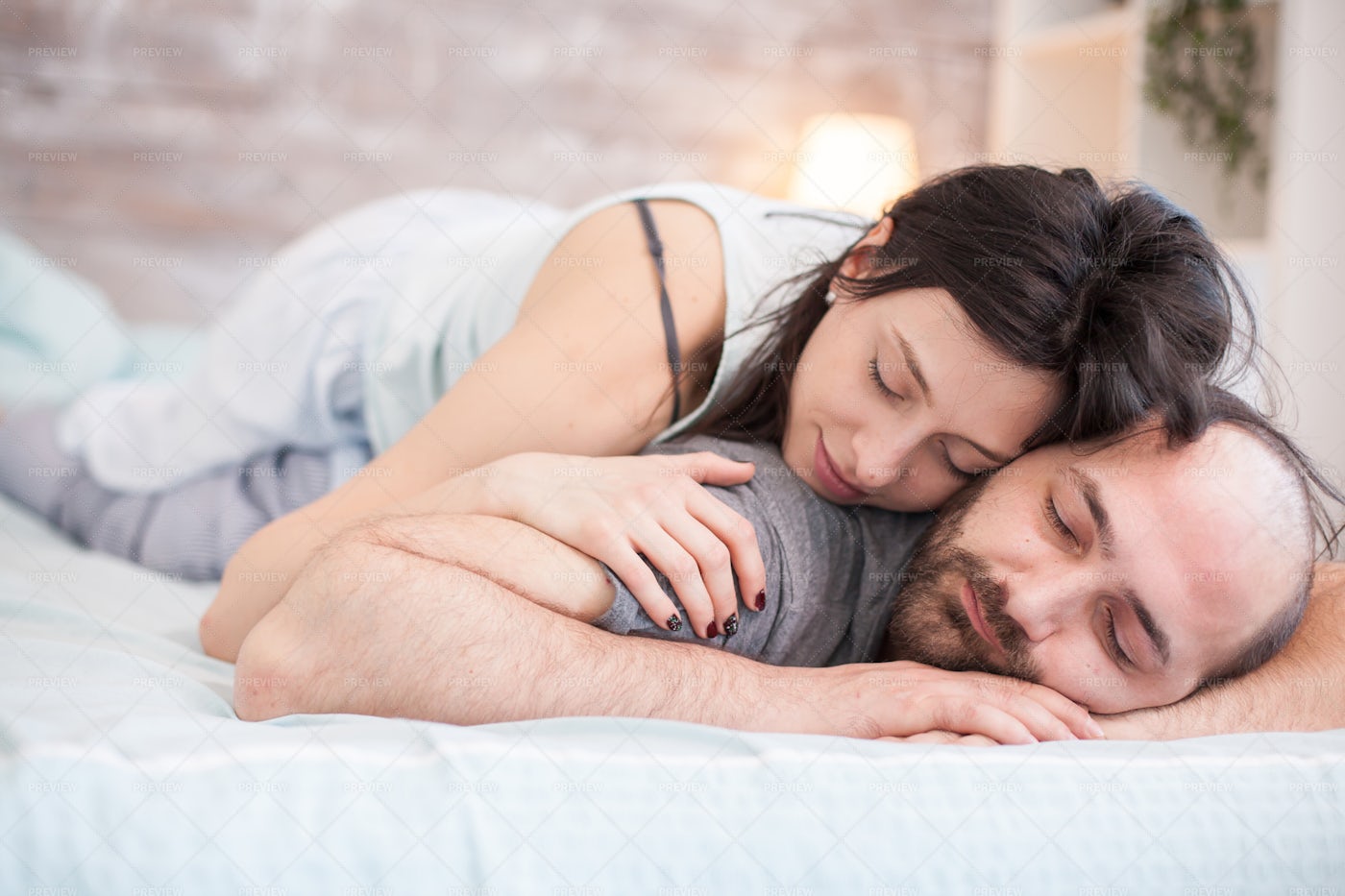 woman-sleeping-on-boyfriend-stock-photos-motion-array