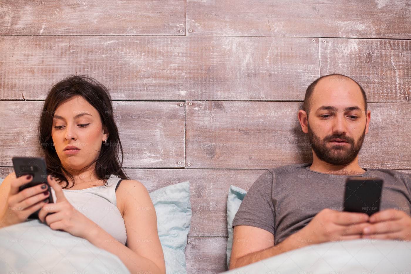 Using Smartphone In Bed: Stock Photos