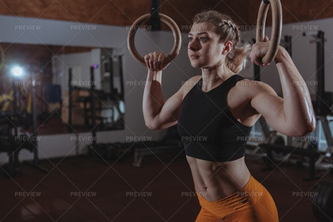 Fitness female exercising on gymnastic rings stock photo (123619