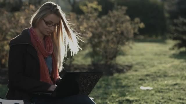 Woman With Laptop In City Park: Stock Video
