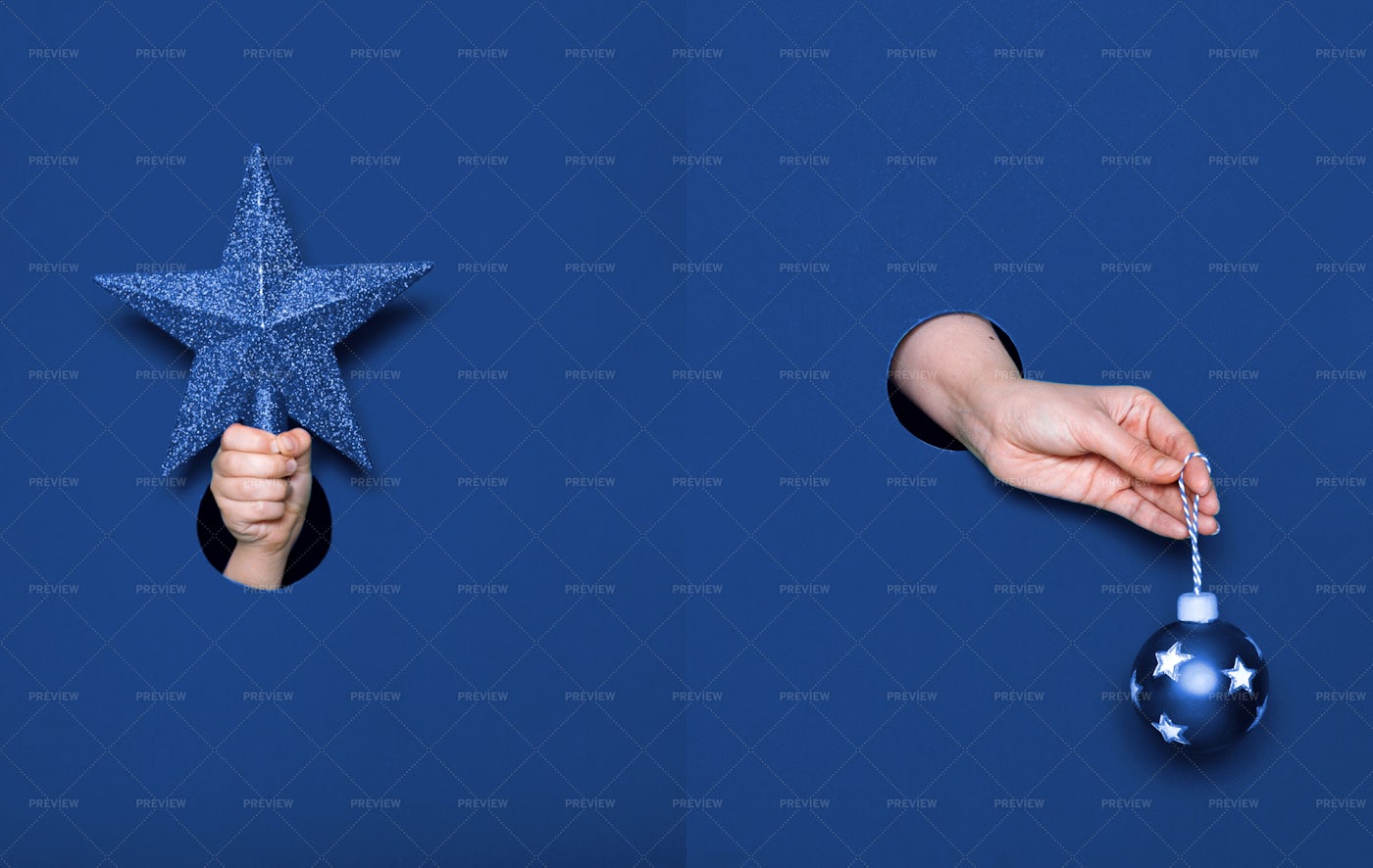Hands With Christmas Decoration: Stock Photos