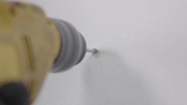 Worker Drilling Hole In The Wall: Stock Video