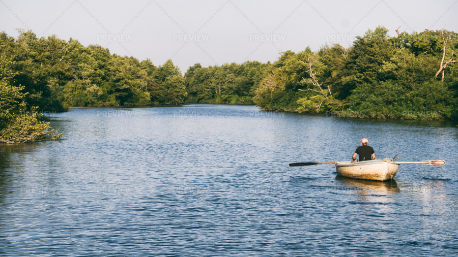 man paddling a boat        
        <figure class=