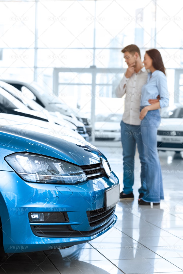 Couple Choosing A Car: Stock Photos