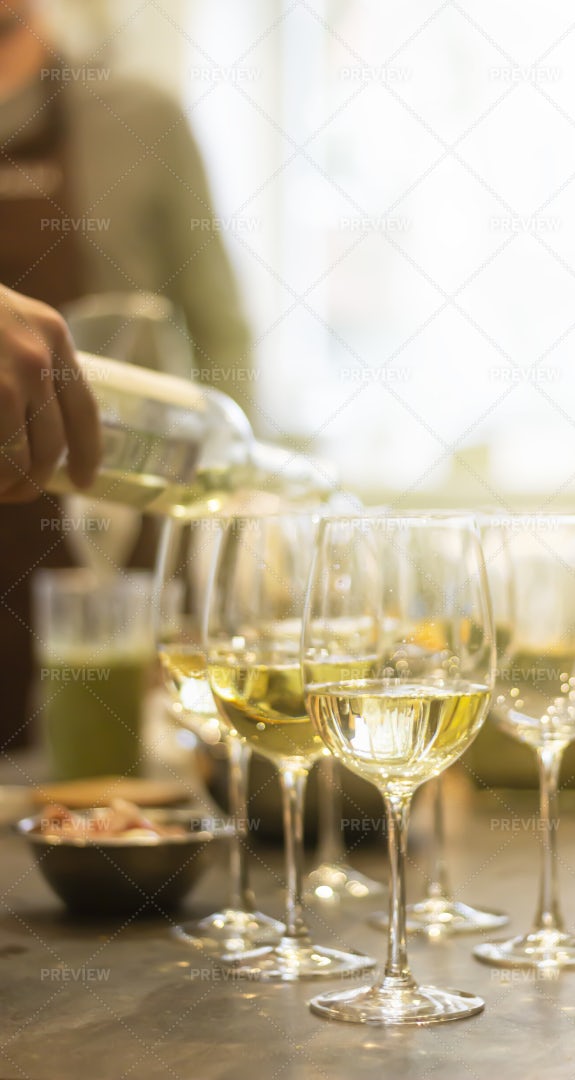 Pouring Wine Into Glasses: Stock Photos