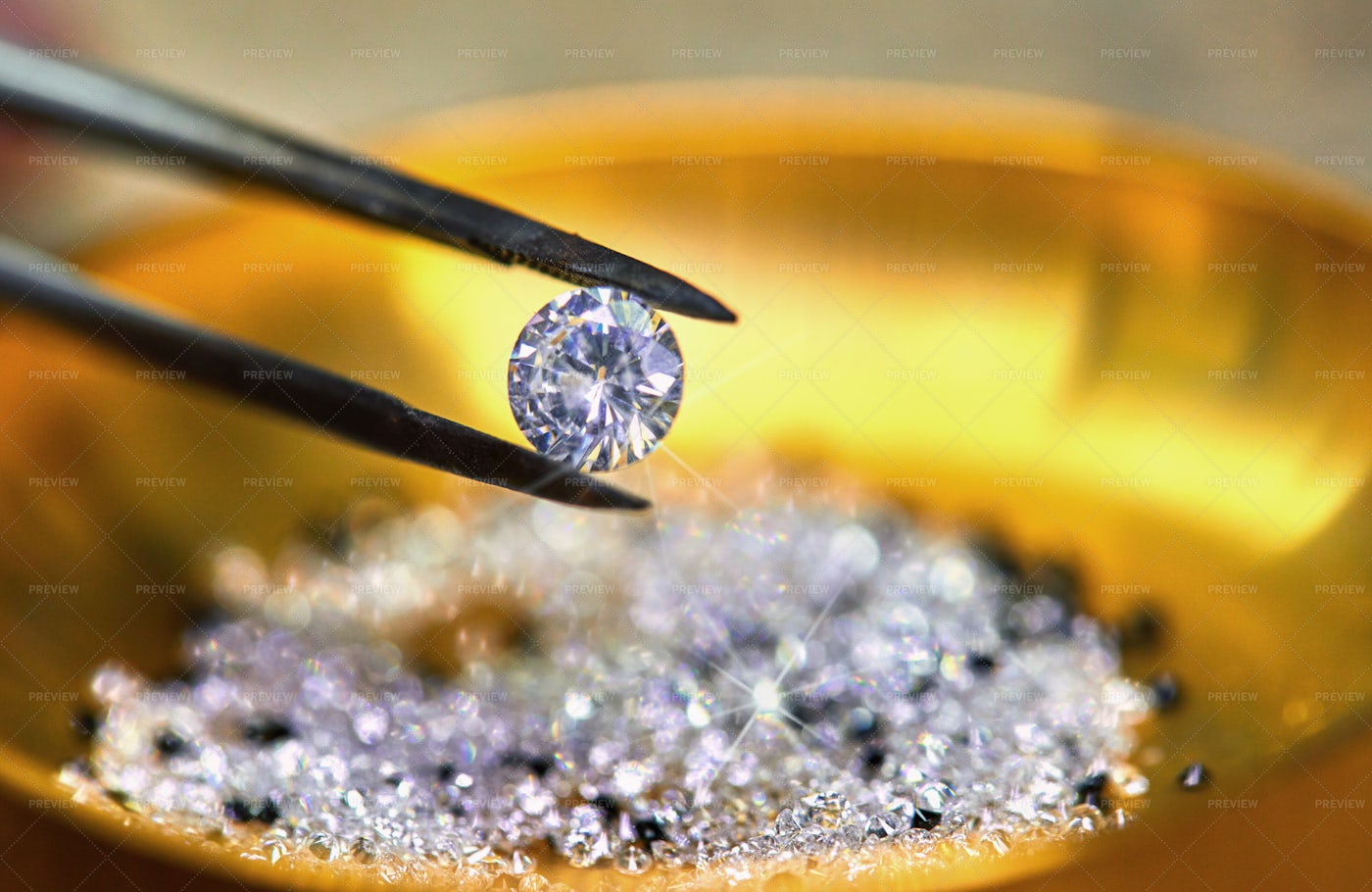 Holding Diamonds By Tweezers: Stock Photos