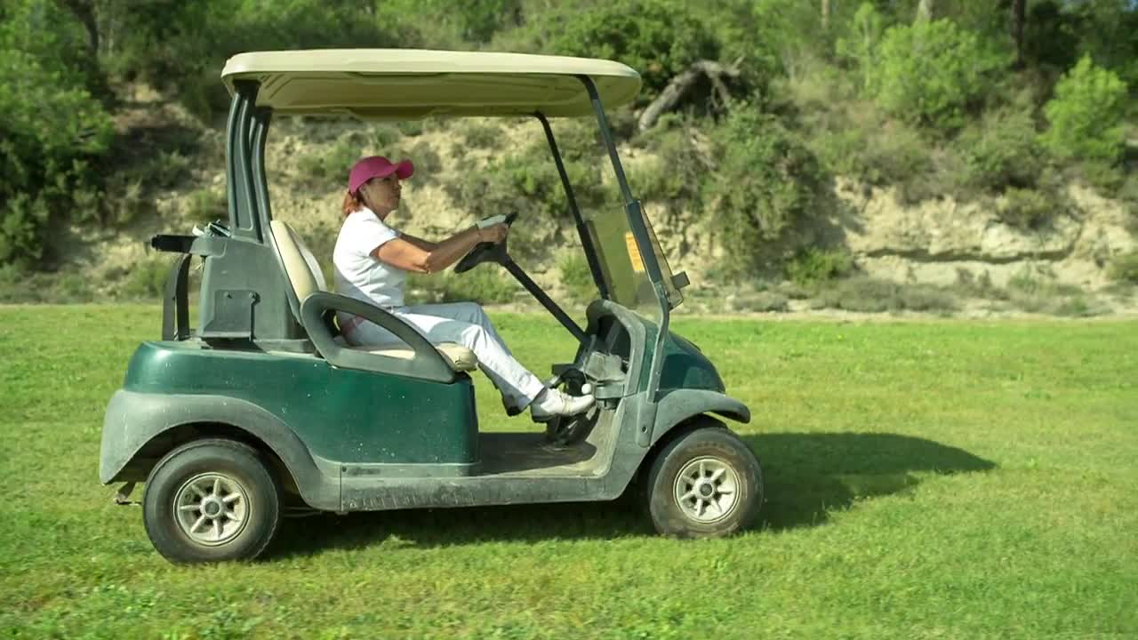 Driving A Golf Cart Stock Video Motion Array