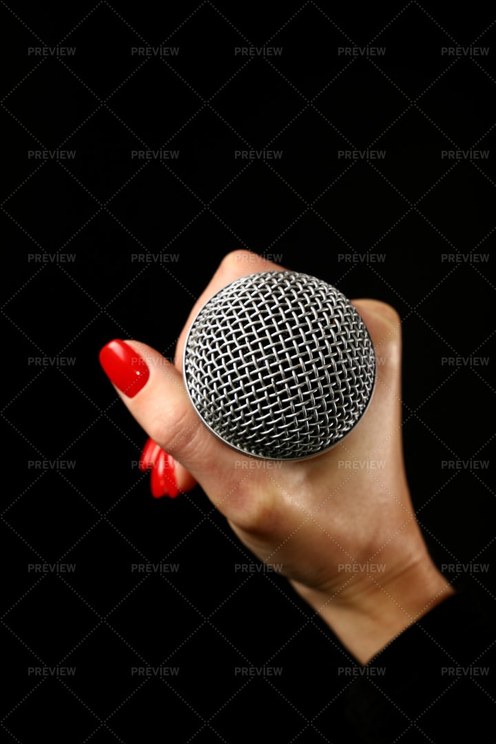 Holding A Microphone: Stock Photos