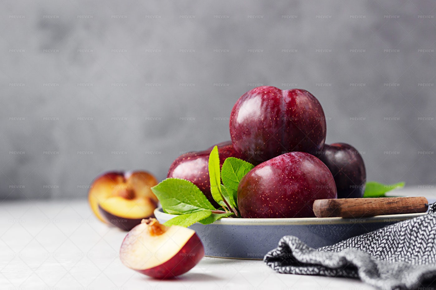 Sliced Purple Plums: Stock Photos