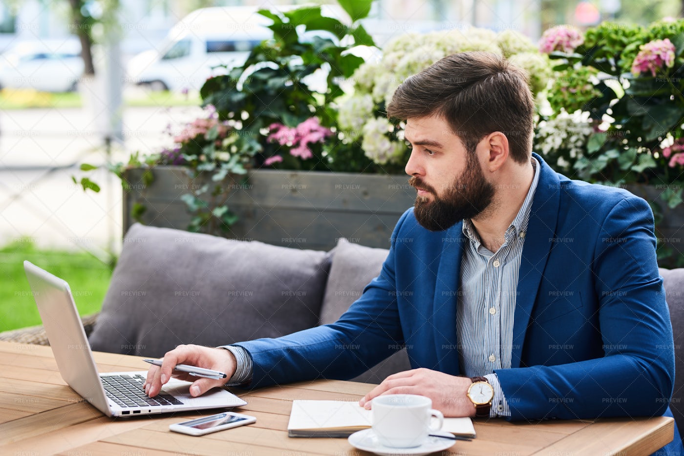 Bearded Businessman Working In Cafe...: Stock Photos