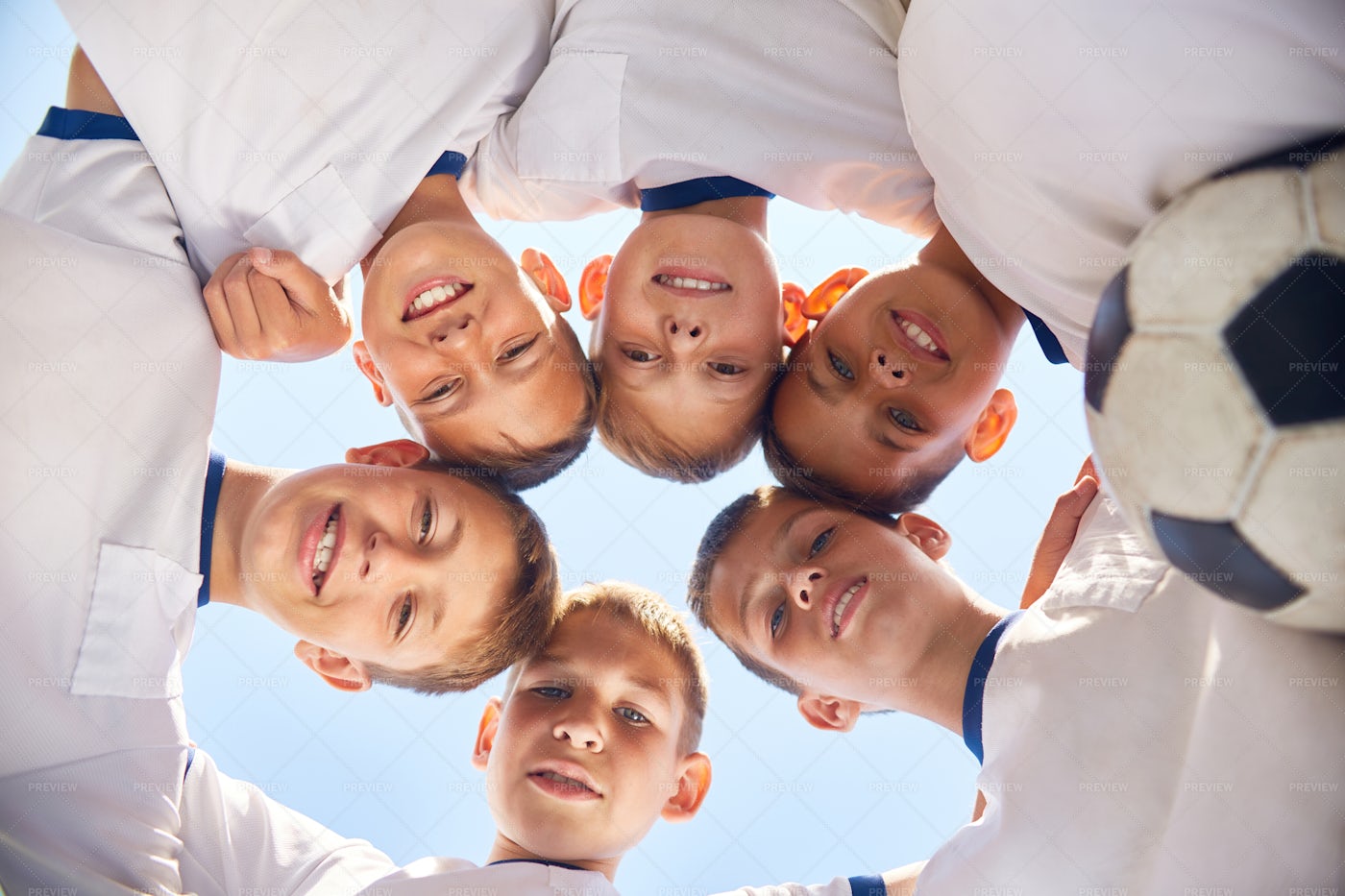 Junior Football Team Huddling...: Stock Photos