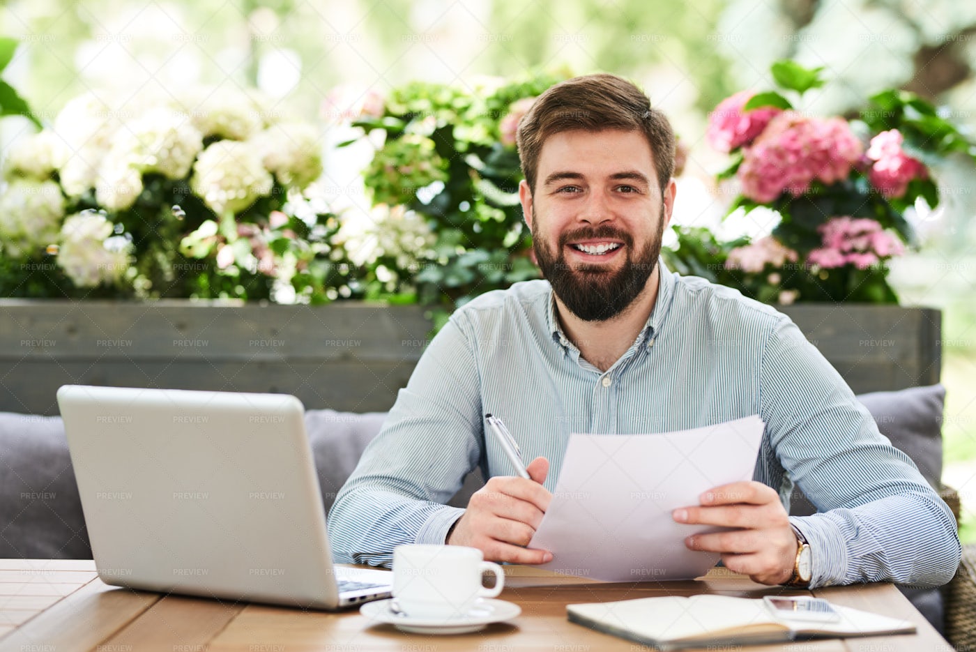 Smiling Entrepreneur Working In...: Stock Photos