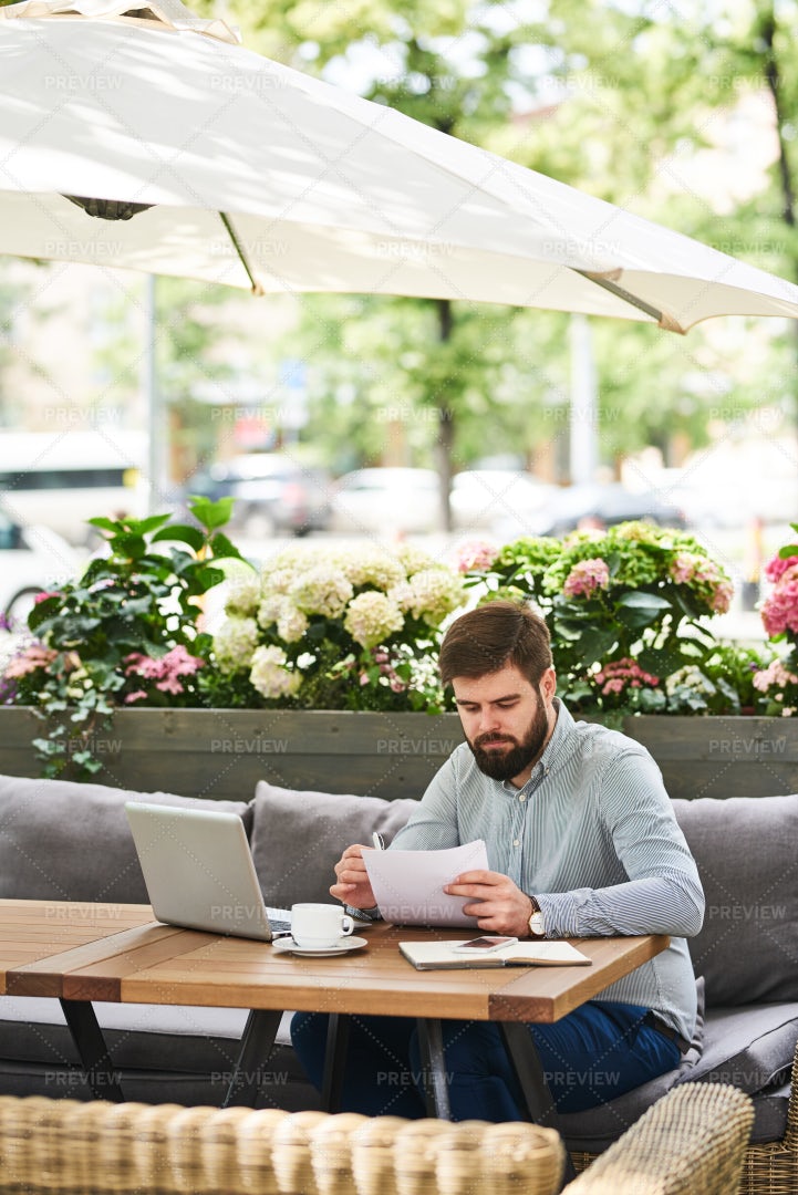 Busy Businessman Working In Cafe...: Stock Photos
