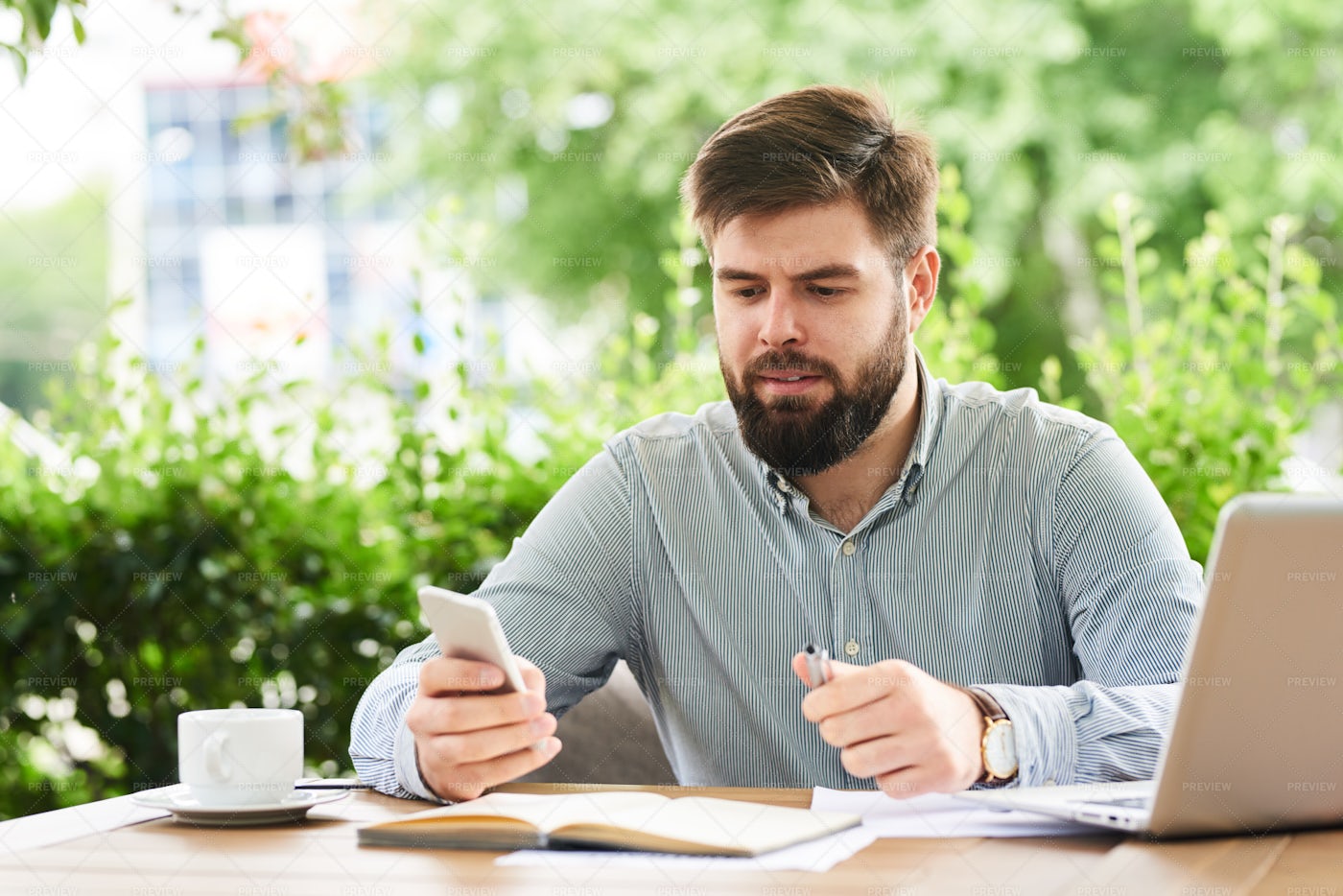 Businessman Using Smartphone For...: Stock Photos