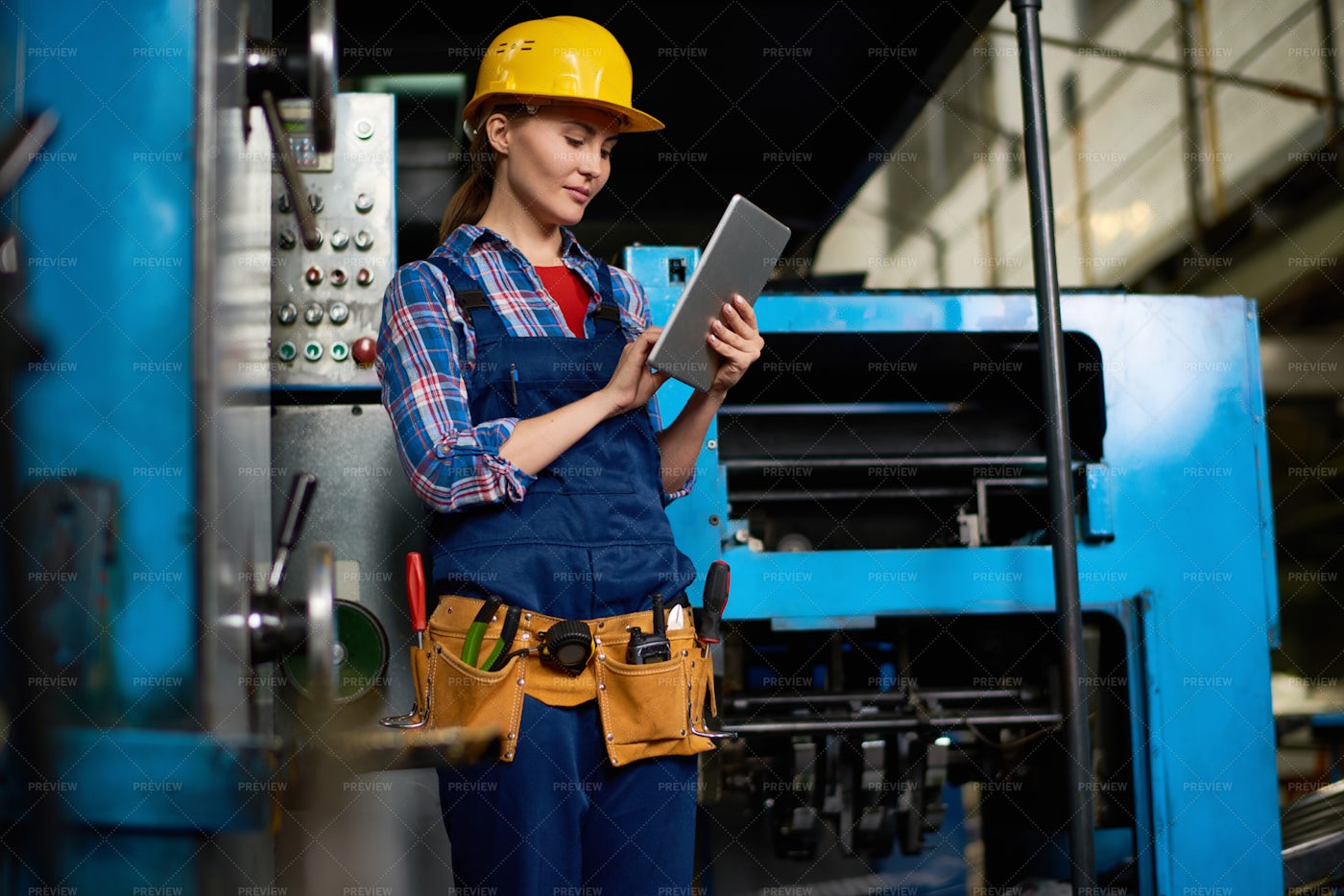 Female Technician Working At...: Stock Photos