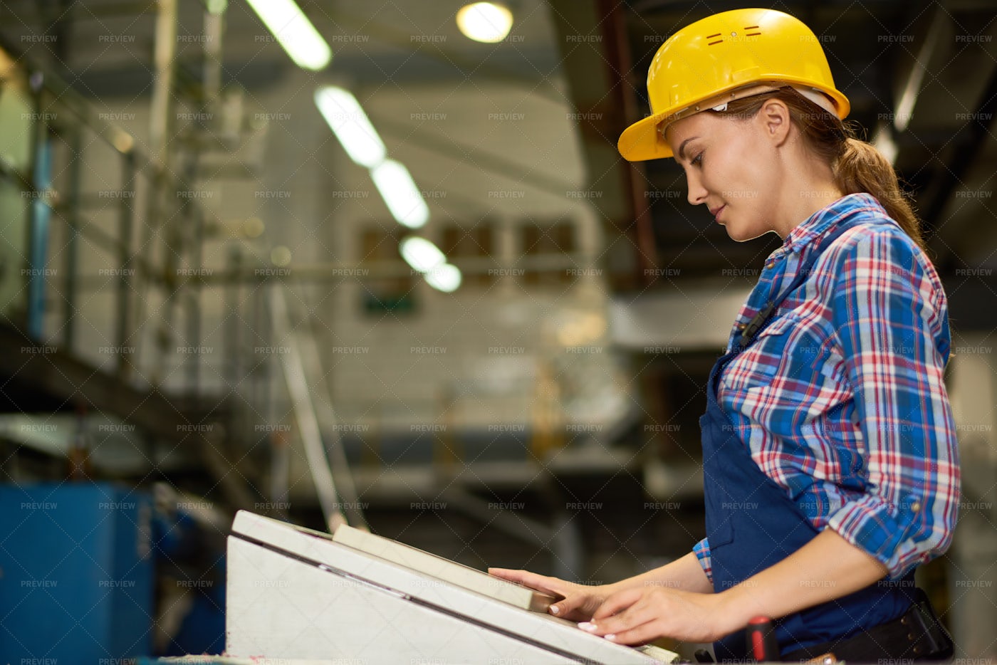 Young Woman Operating Machine Units...: Stock Photos