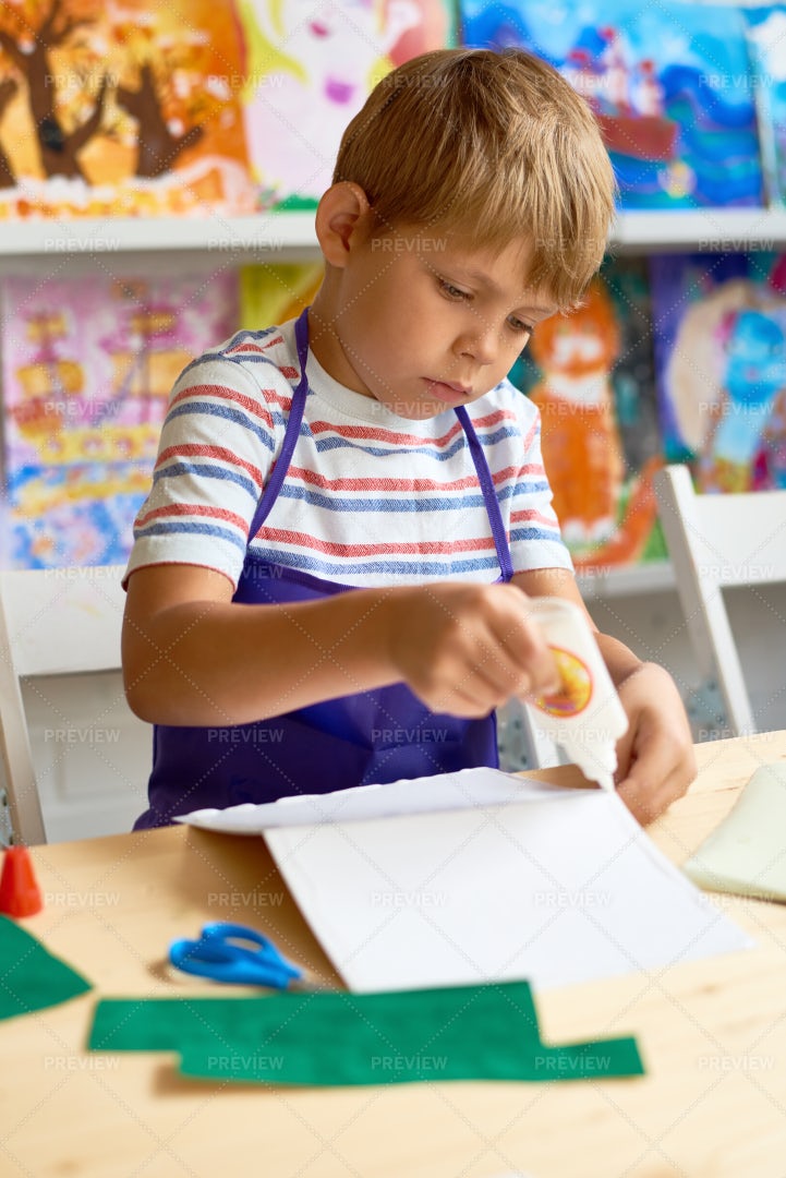 Little Boy Crafting In Class: Stock Photos