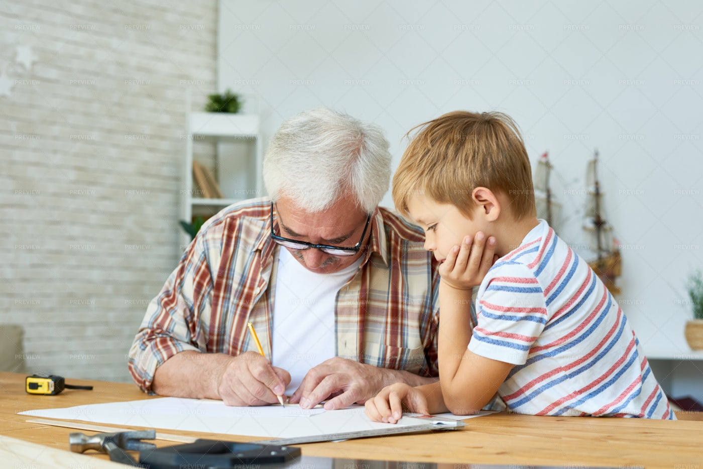 Grandfather And Little Boy Drawing...: Stock Photos
