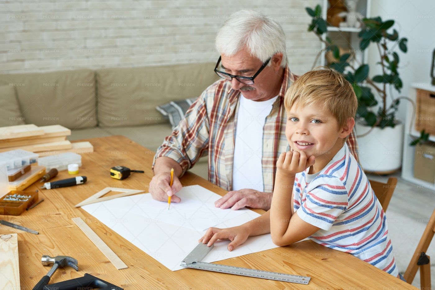 Little Boy Helping Grandpa Make...: Stock Photos