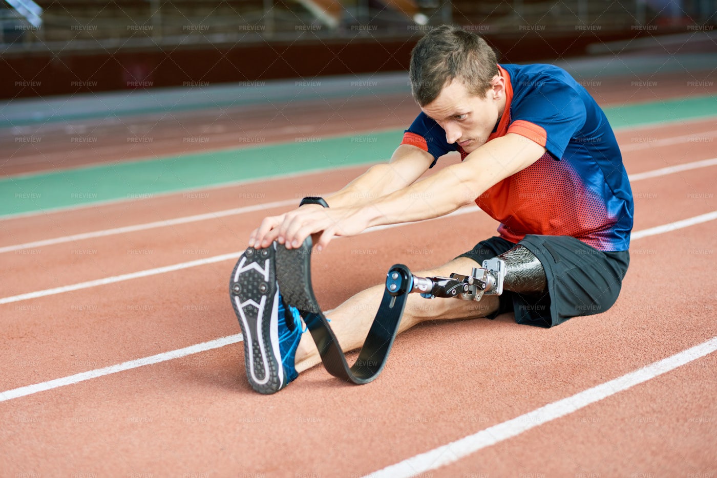 Handicapped Sportsman Stretching In...: Stock Photos