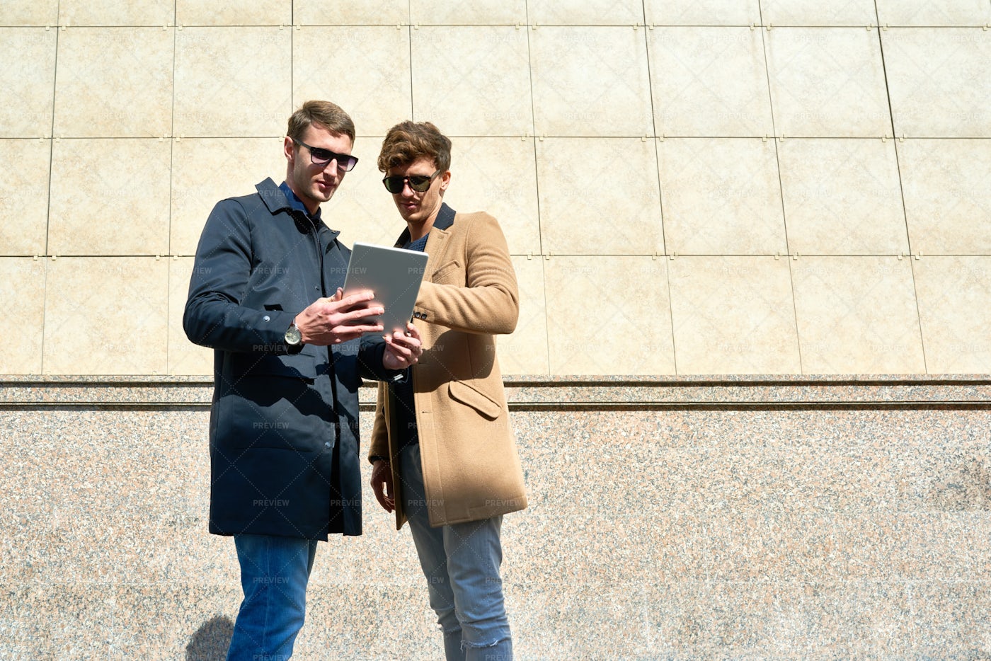 Two Handsome Businessmen Using...: Stock Photos