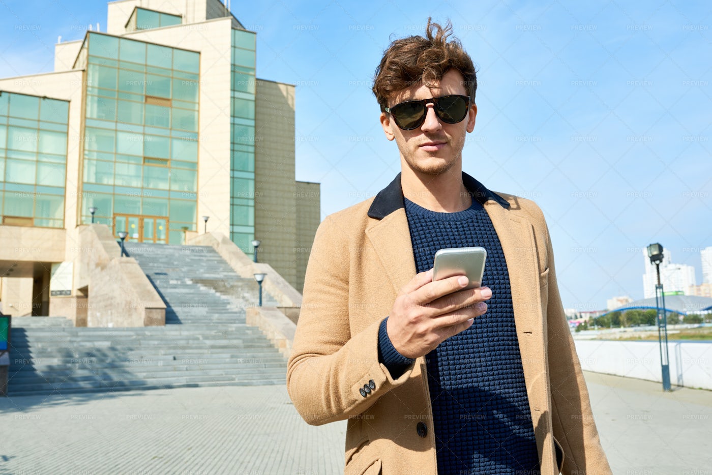 Handsome Young Man With Smartphone...: Stock Photos