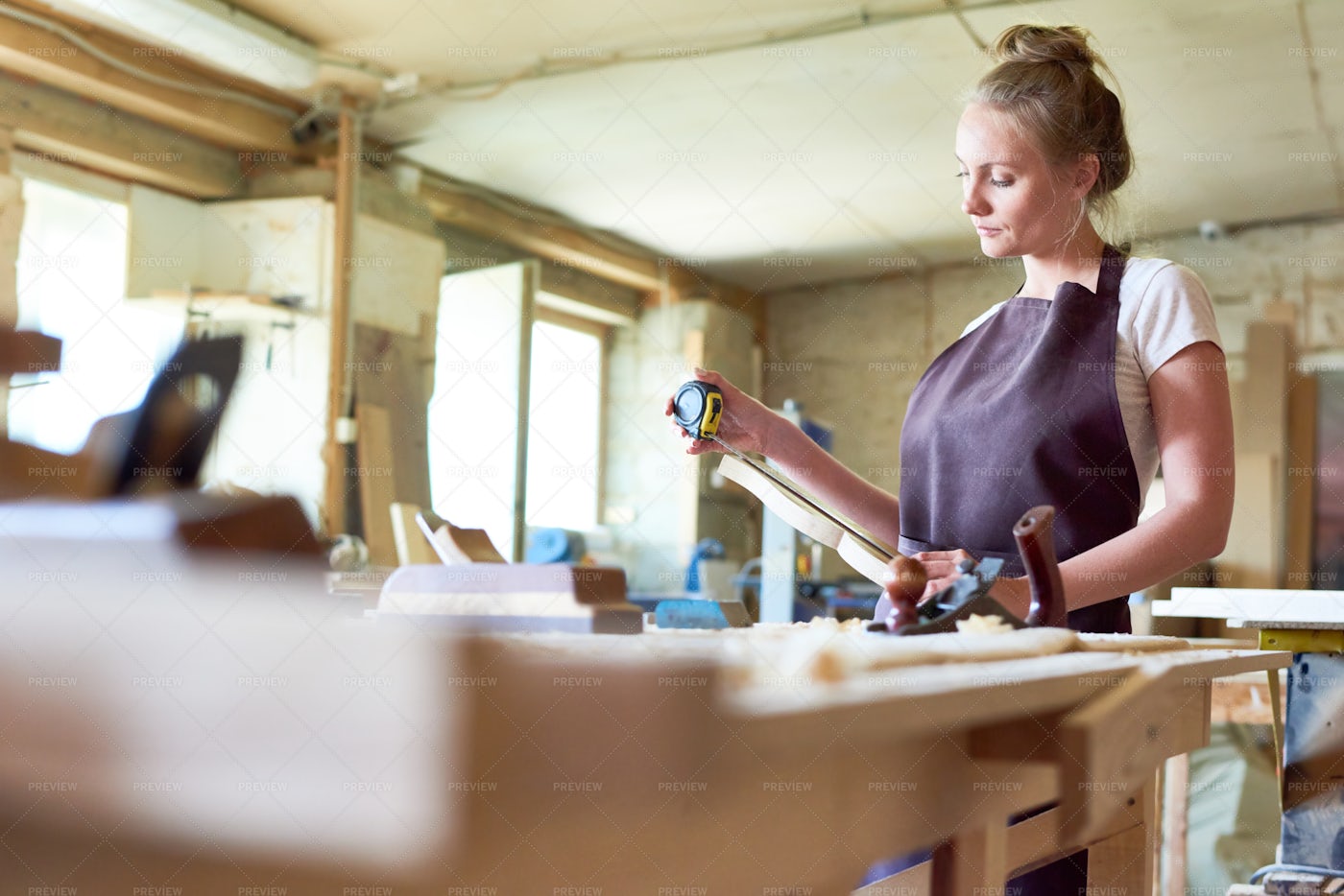Female Carpenter Working In Shop: Stock Photos