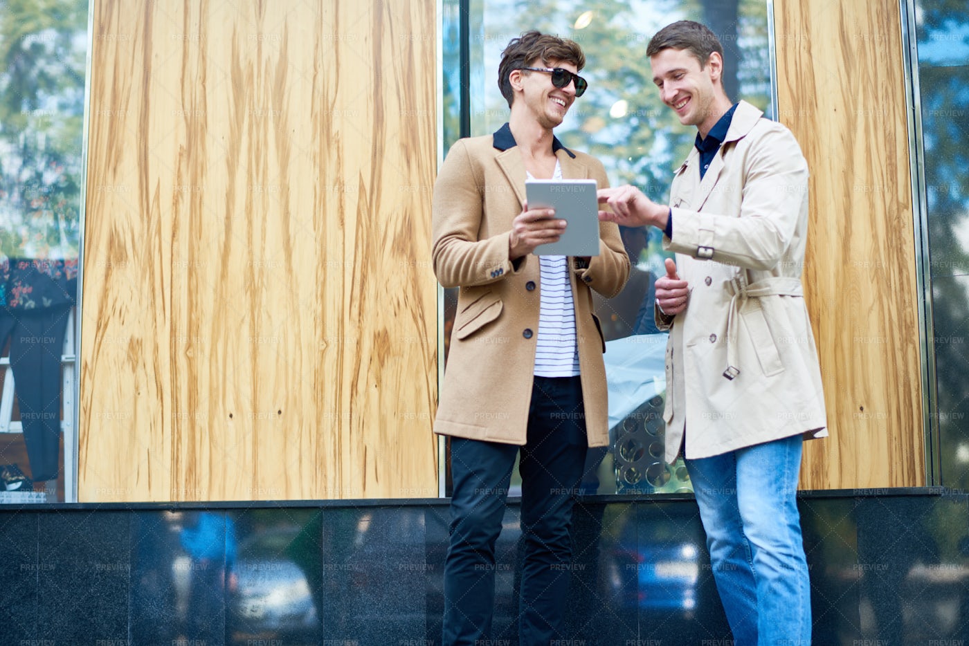Two Smiling Business People Using...: Stock Photos