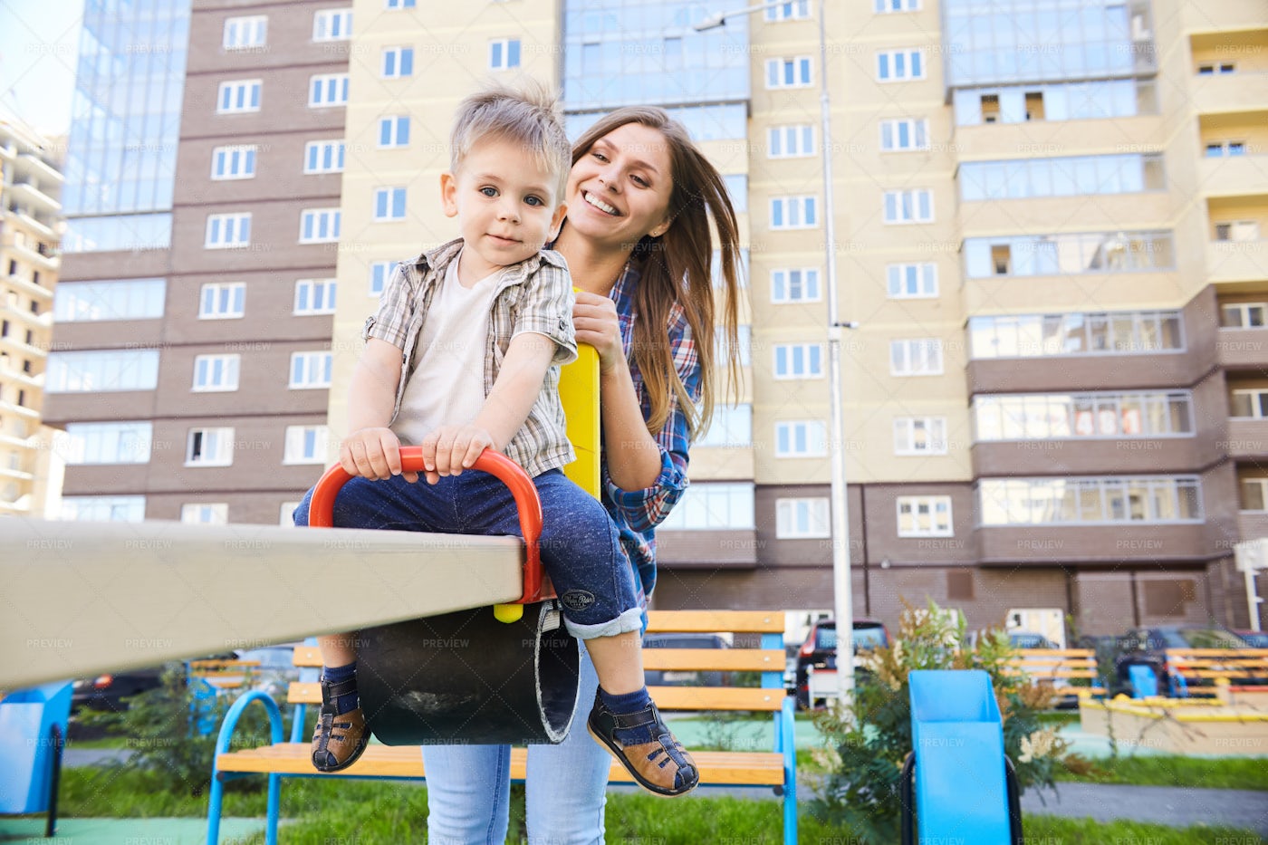 Loving Mother And Son On Playground: Stock Photos